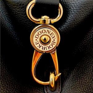 Dooney and Bourke black leather hobo bag. Like new - used once